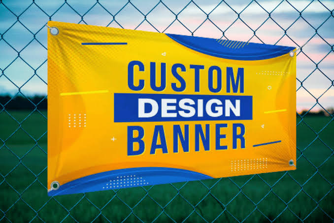 Custom design vinyl banner mounted on a chain-link fence